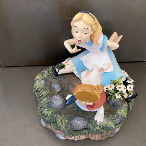 Image from The Keepthings of a figure of cartoon Alice from Alice in Wonderland speaking with the rabbit.