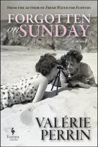 Cover of Forgotten on Sunday by Valérie Perrin, featuring a black-and-white photograph of two people looking into a camera on a beach.