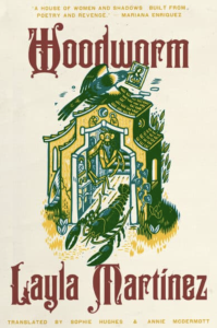 Cover of Woodworm featuring a yellow and green print of a lobster and a praying mantis in a house with a bird on the roof.