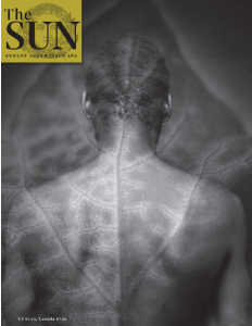 Cover of The Sun, featuring a black-and-white photo of a shirtless person with their back to the camera overlaid with a close-up shot of the veins in a leaf.